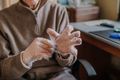Elderly man puts on disposable protective gloves - PhotoDune Item for Sale