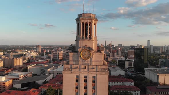 Shot of the top of the UT Tower on campus. Drone flys towards the tower and reveals downtown in the