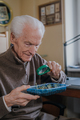 Senior observes sprouts of green vegetables - PhotoDune Item for Sale