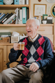 Old man drinking coffee at home - PhotoDune Item for Sale