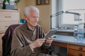 Positive Senior using Digital Tablet - PhotoDune Item for Sale