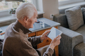 Positive Senior using Digital Tablet - PhotoDune Item for Sale