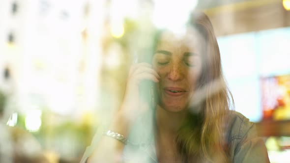 Young woman talking on cell phone