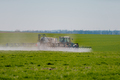 Tractor Spraying Herbicides on Field Agriculture - PhotoDune Item for Sale