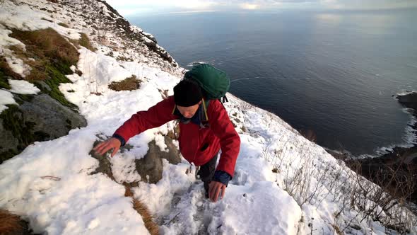 Mature Hiker In Snow On Mountain Side