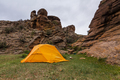 Orange tent near a huge rock. Mongolia. - PhotoDune Item for Sale