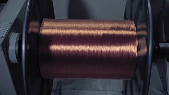 Winding Cable on a Rotating Coil. Production of Electric Cable.
