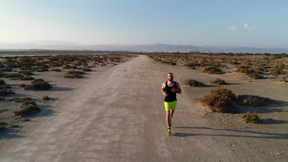 Aerial Shot of Sporty Man Jogging in Nature in Summer