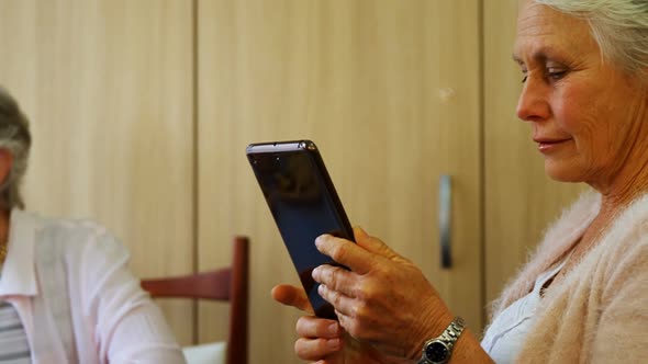 Senior woman using digital tablet 4k