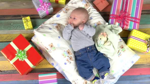 Baby and Colorful Presents.