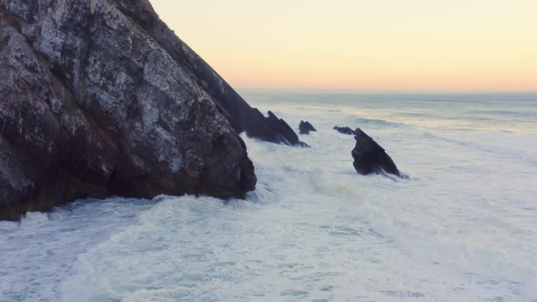 Aerial Drone View of Portugal Atlantic Coast at Lisbon, a Dramatic Rugged Rocky Coastline with Waves