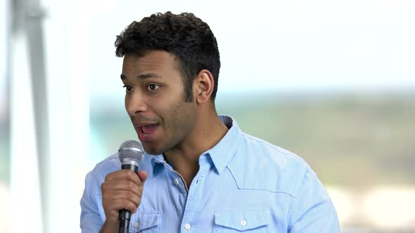 Cheerful Man Presenter Holding Microphone