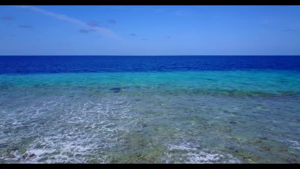 Aerial above sky of relaxing coast beach vacation by shallow sea with clean sandy background of a pi