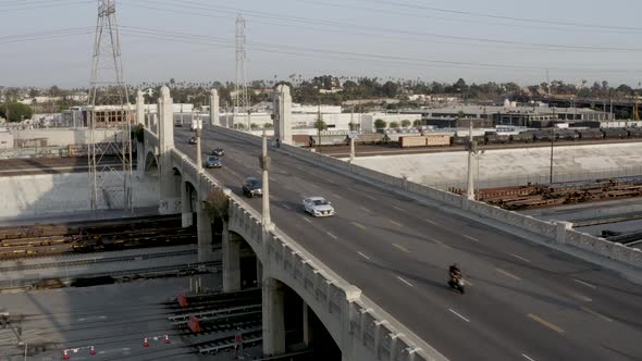 Urban City Concept - Cars Driving on Bridge Overpass in Los Angeles. Static Aerial Drone Establishin