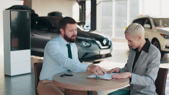 Giving the Customer the Car Keys After Signing the Lease