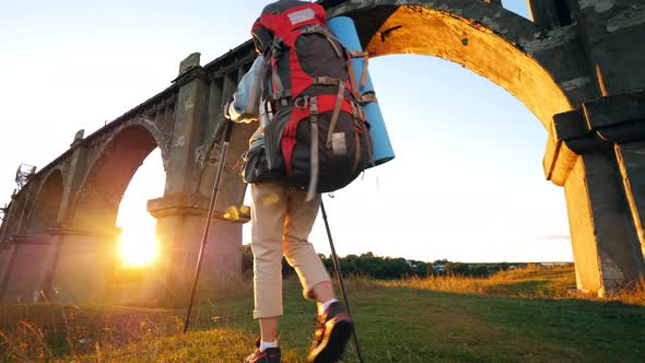 Female Sports Tourist Is Passing By a Deserted Bridge