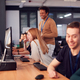 Group Of College Students With Tutor Studying Computer Design Sitting At Monitors In Classroom - photodune.net Item for Sale