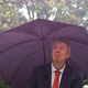Businessman Sheltering Underneath an Umbrella in the Rain - VideoHive Item for Sale