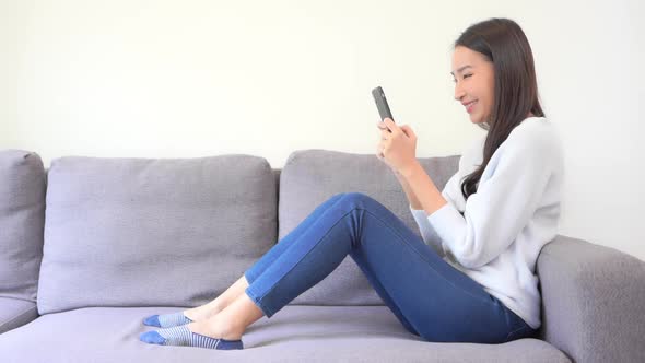 Young asian woman use smart phone