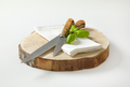 Two sharp kitchen knives on round wood slab - PhotoDune Item for Sale