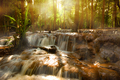 Pa Wai Waterfall with sun rays shining through the trees, Tak Thailand - PhotoDune Item for Sale