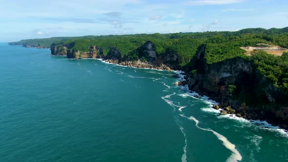 Picturesque coastal cliffs on tropical Java Island, Indonesia, aerial view