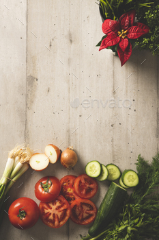 Light color wooden background with ingredients for salad