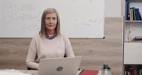 Portrait of Cheerful Female Professor Looking To Camera