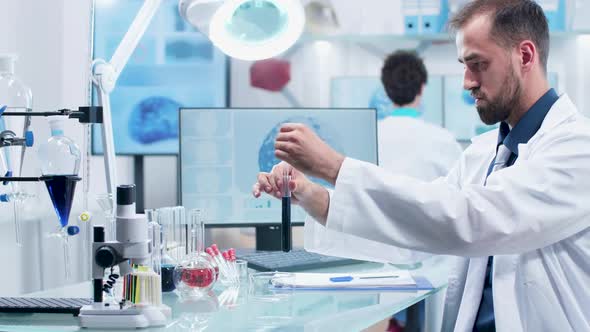 Scientist Working with Different Samples in Modern Laboratory