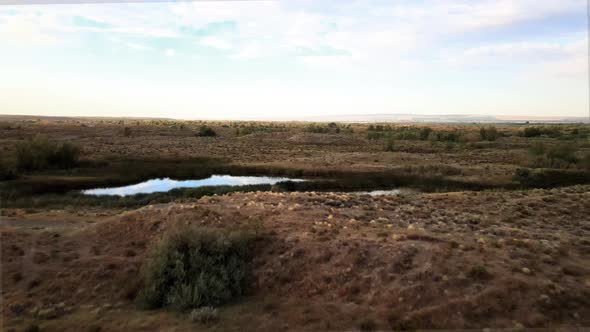 Small lakes surrounded by desert scrubland and marsh, Potholes, Washington, aerial