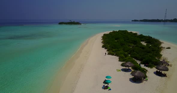 Beautiful above island view of a paradise sunny white sand beach and aqua turquoise water background