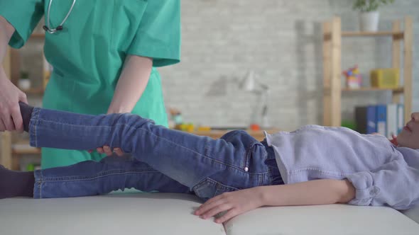 Little Boy with Leg Pain at Physiotherapist's Appointment