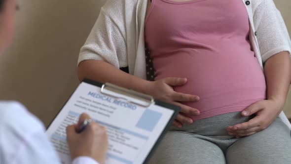 Pregnant Woman and Gynecologist Doctor at Hospital