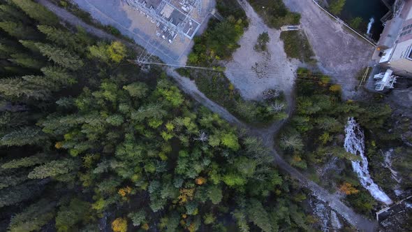 Hydroelectric power station in the middle of the woods seen from above by a drone in Canada. Hydroel