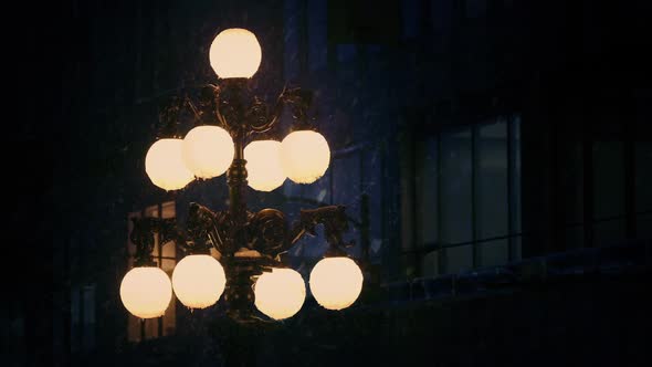 Old Fashioned Streetlight In Snowfall alt