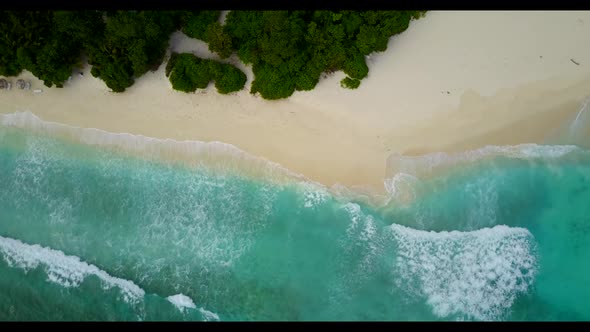 Aerial drone view scenery of paradise coast beach holiday by blue water with bright sandy background