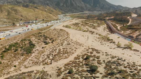 Aerial of Curvy Highway in Scrubby Desert