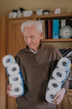 Old man holding two packs of toilet paper - PhotoDune Item for Sale