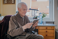 Positive Senior using Digital Tablet - PhotoDune Item for Sale