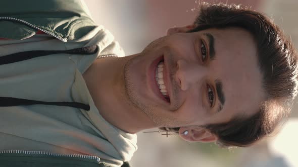 Portrait of Male Hipster Smiling While Standing on Street