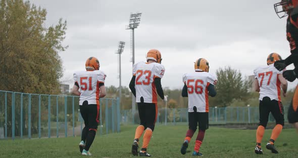 American Football Training Day, Athletic Football Players Gets Hug and High-five Each Other, After
