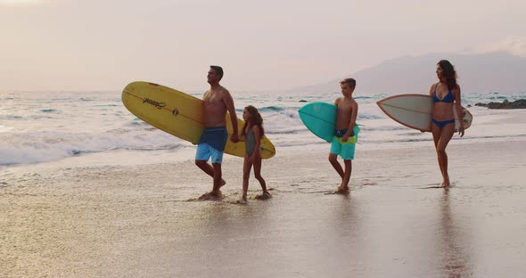Young Family Going Surfing