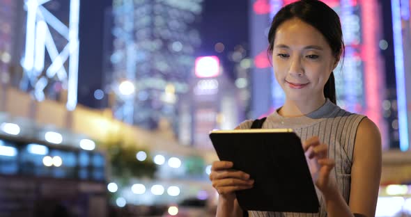 Woman looking at tablet computer