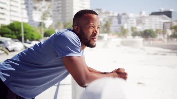 Thoughtful man leaning on the beach 4k