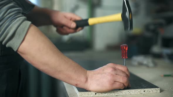 Man Working with a Hammer