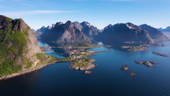 Flight over the sea and view on the fishing village Reine and Hamnoya ,Lofoten Islands,Norway