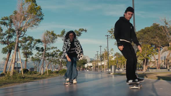 Hipster Couple Skateboarding