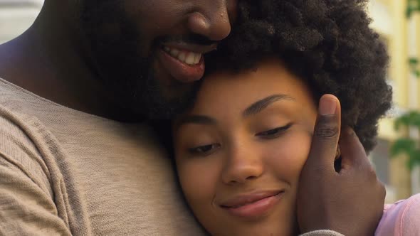 Man Tenderly Embracing Loving Girl, Trust and Safety in Relationship, Closeup