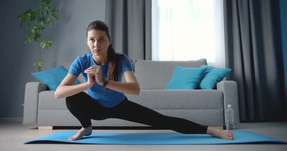 Relaxed Woman Stretching Legs at Home