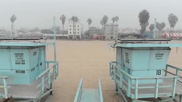 Flying between two lifeguard stands on Venice Beach, CA in a thick marine layer.